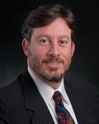 Professional headshot of John Verboncoeur