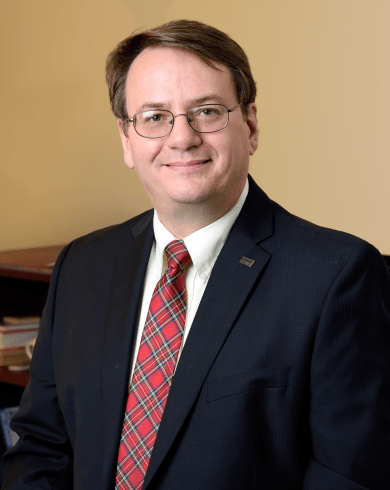 Professional headshot of Leo Kempel